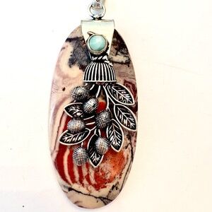 2 1/2 inch, Leaf  Porcelain with silver flowers down the front on a silver chain